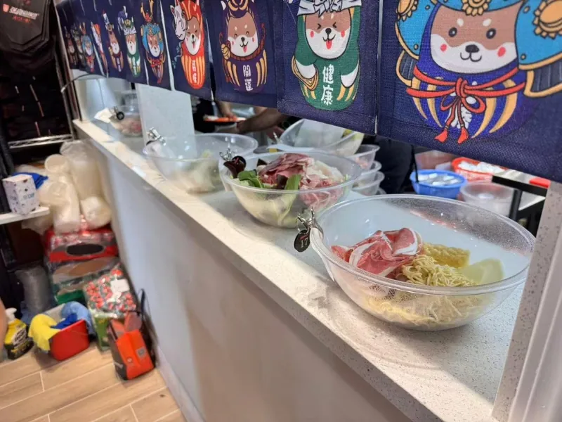 Ingredient bowls at food bar at Zhangliang Malatang Spicy Hotpot, a Hot Pot Restaurant in National City
