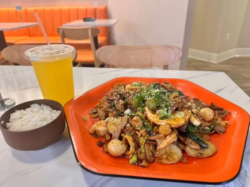 Spicy stir-fry with rice & drink at Zhangliang Malatang Spicy Hotpot, a Hot Pot Restaurant in National City